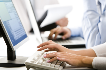 Female hands on computer